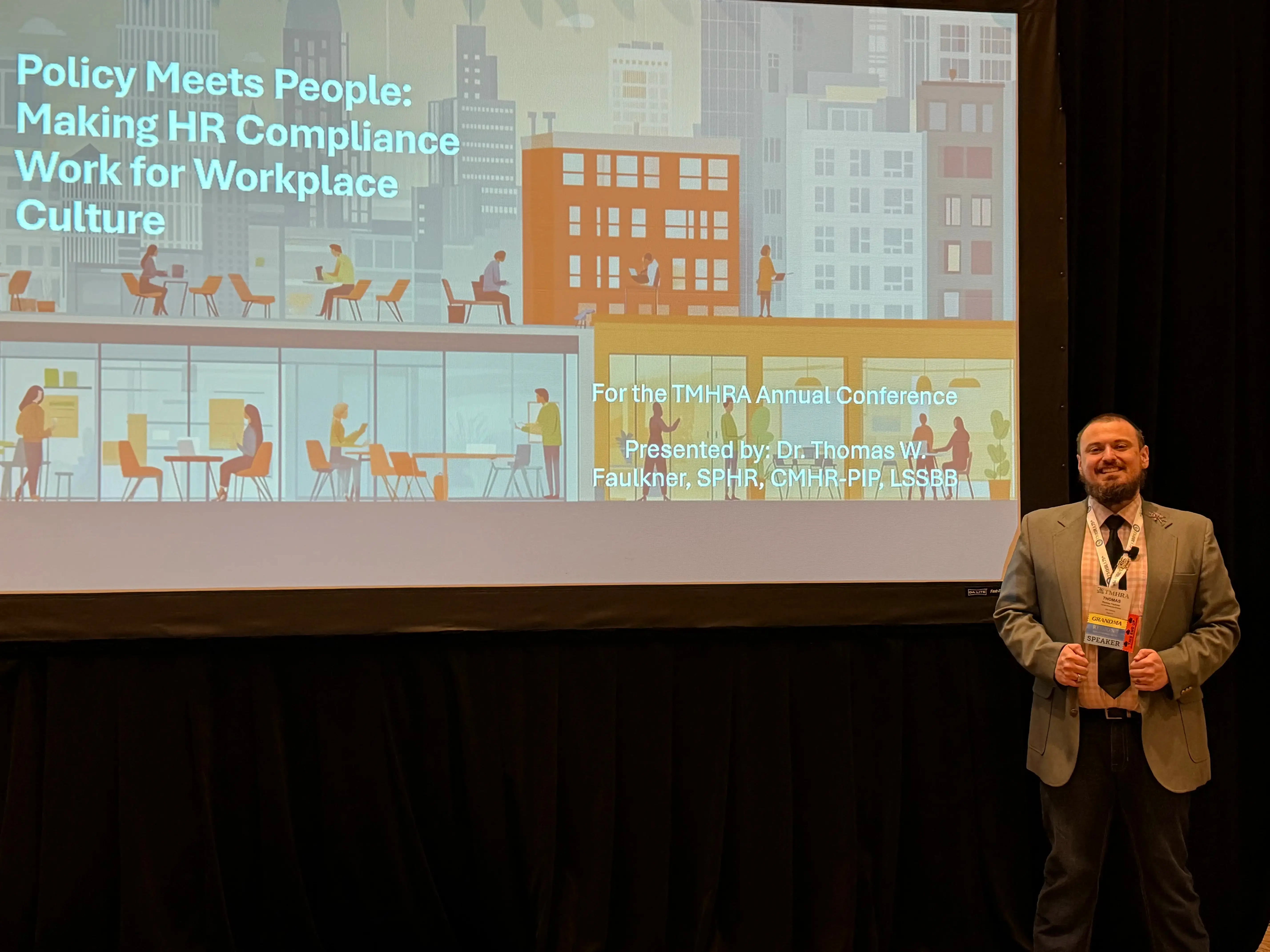 Dr. Faulkner presenting at a conference session